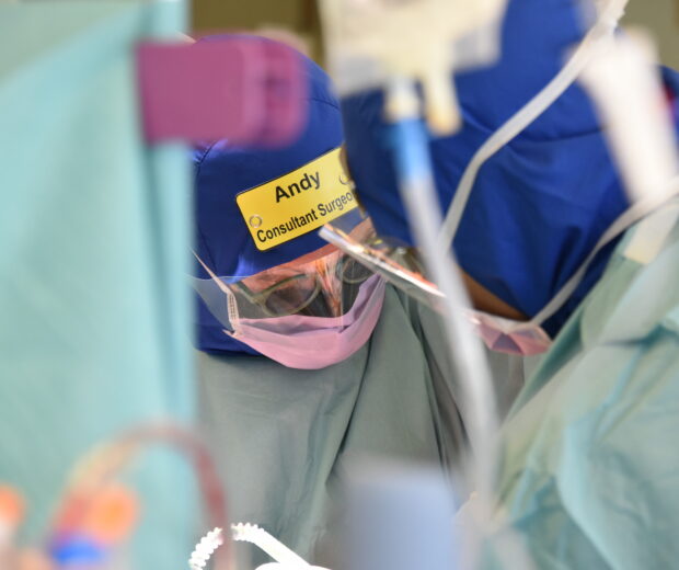 Two surgeons wearing the Eco Ninjas badges in surgery.