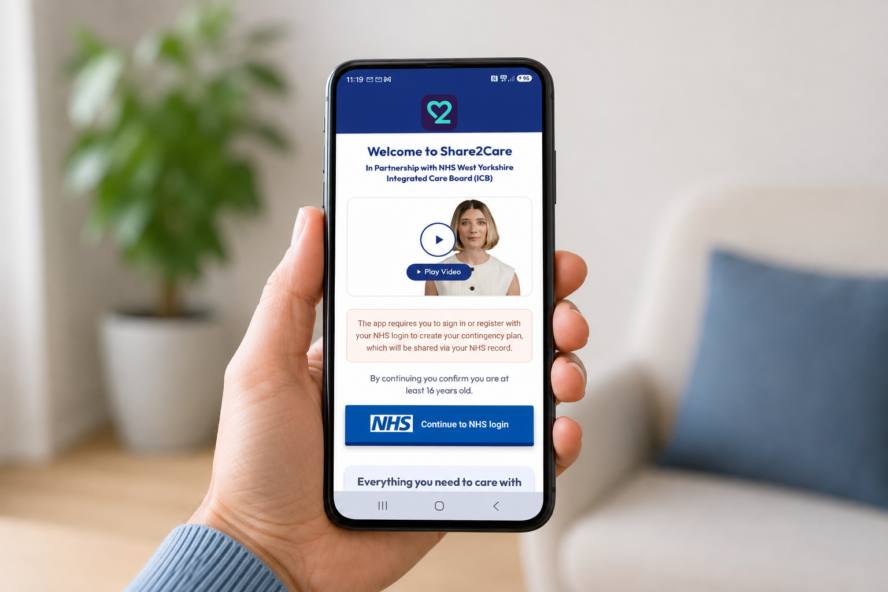 Share2Care West Yorkshire ICB app in use on a phone in a persons hand.